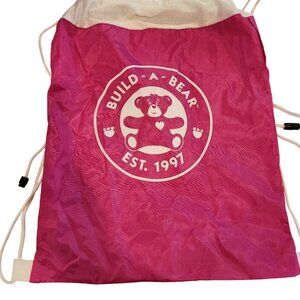 Build-A-Bear Workshop pink drawstring toy carrier backpack.